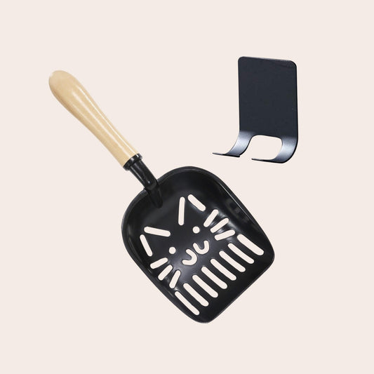 Durable metal Litter-Slaying Scoop with ergonomic handle and charming cat face design, perfect for efficient cat litter cleaning